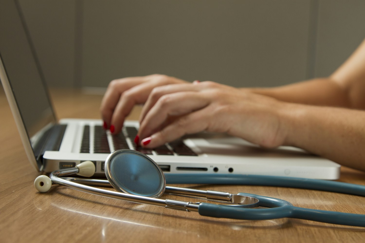Clinician reviewing patient results on a laptop