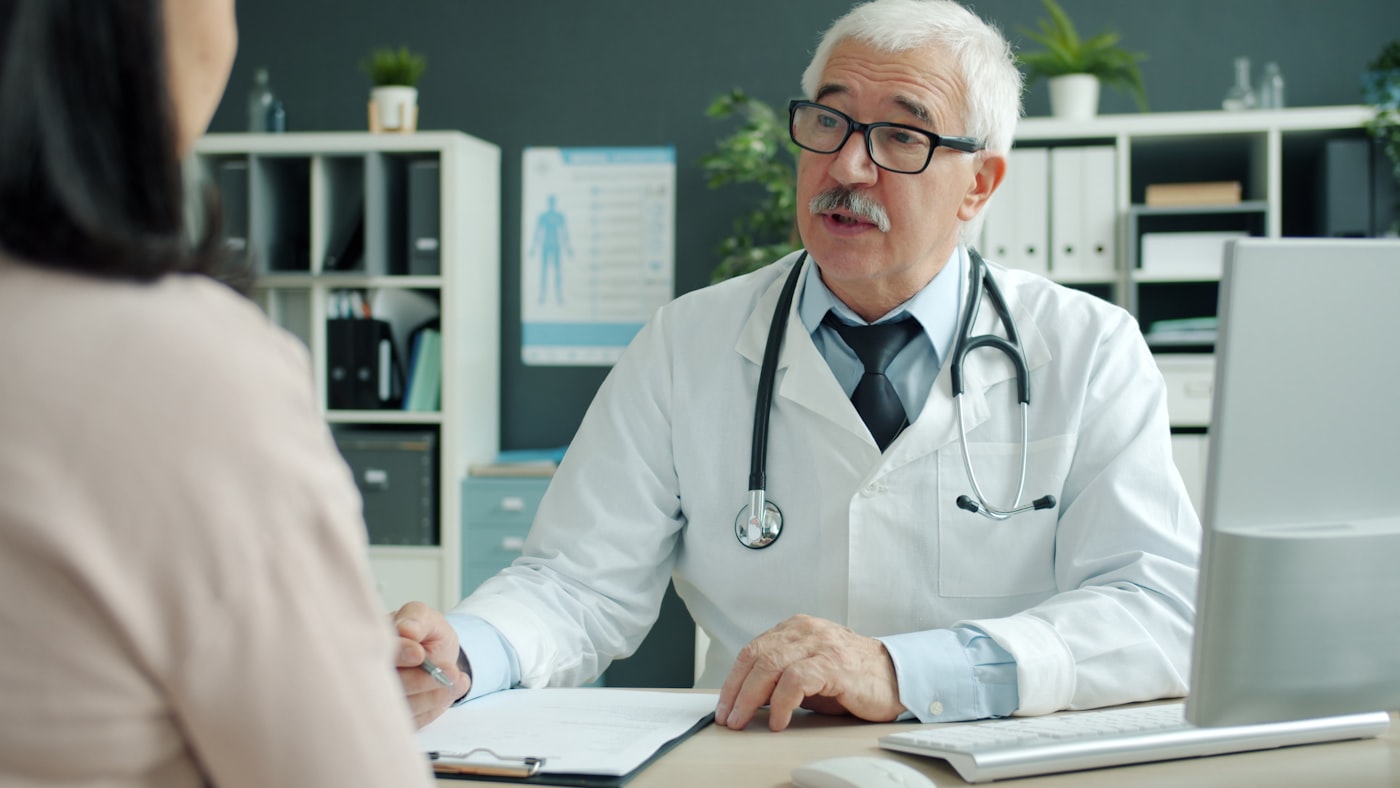 Doctor talking a patient through their care plan